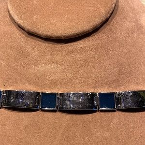 Joan Rivers hinged bracelet.